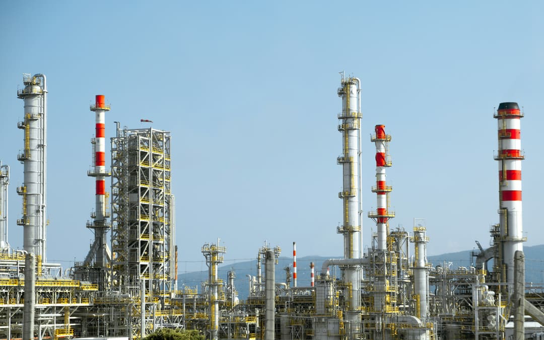 Refinery columns against a clear sky